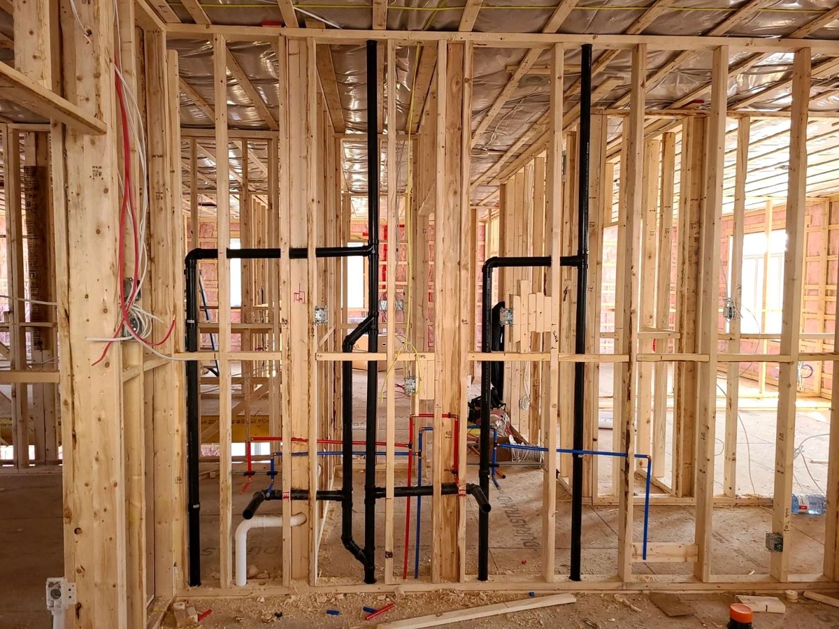 New wood framing with plumbing and electrical rough-in